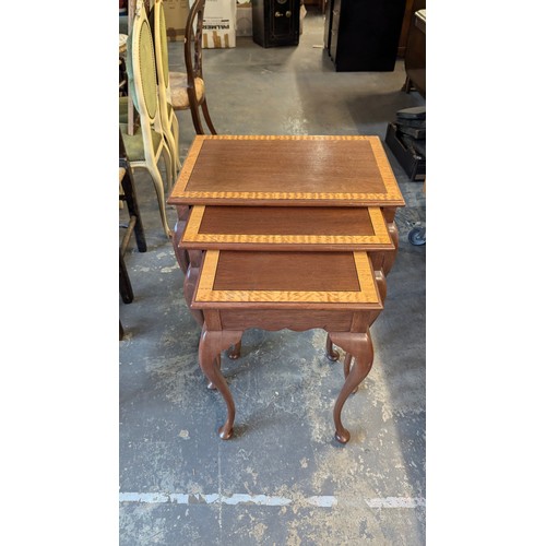 56 - A Nest Of Chippendale Style Inlaid Tables - Tallest 64 x 60 x 40cm