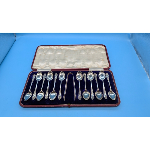 236A - A cased set of hallmarked silver teaspoons and tongs approximately 120gms