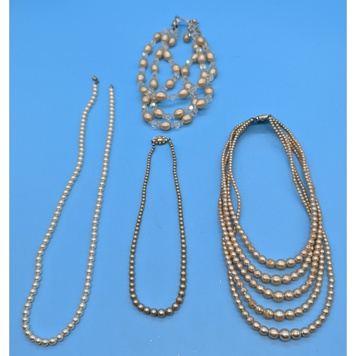 739 - .An Assortment Of Faux Pearl Necklaces