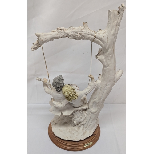 626 - .A Beleinca Porcelain Figure Of A Lady And Gentleman On A Swing - 43cm Tall