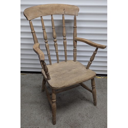 656 - An Antique Stick Back Armchair - 97cm High