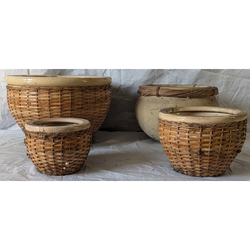 63 - A Nest Of Ceramic Pots With Wicker Style Wrapping - 4 In Total