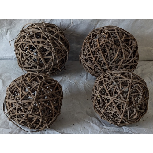 64 - A Box Of 4 Wicker Balls - Some Damage To The Largest