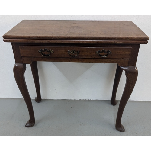 1111 - An Antique Foldover Top Tea Table