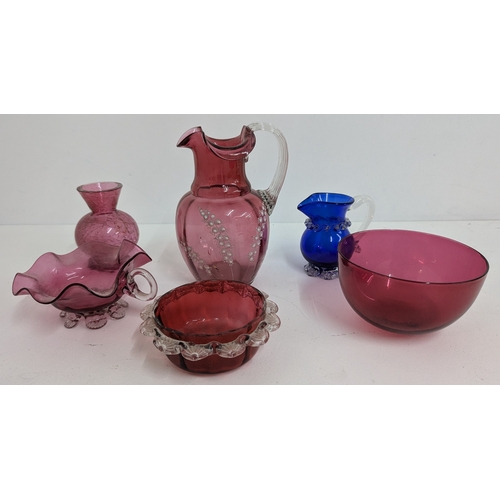 695 - .An Assortment of Cranberry and Blue Glassware