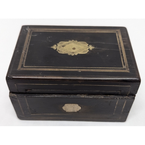 755 - An Ebonised Wooden Box with Coins