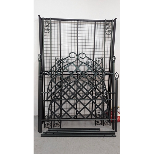 529 - An Ornate Green Metal 4 Poster Bed Frame with Fittings . 130cm W x 192cm L