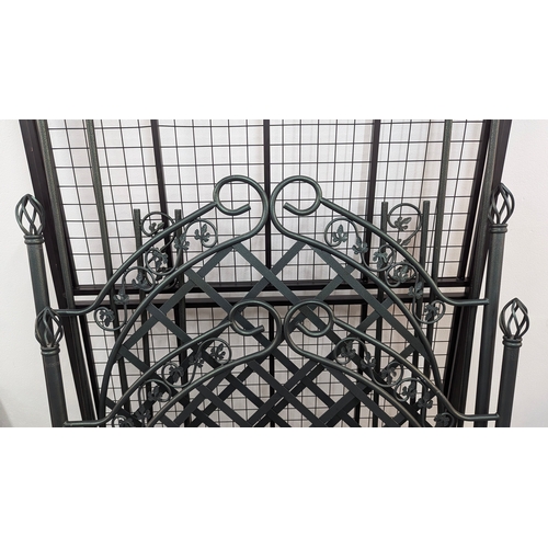 529 - An Ornate Green Metal 4 Poster Bed Frame with Fittings . 130cm W x 192cm L