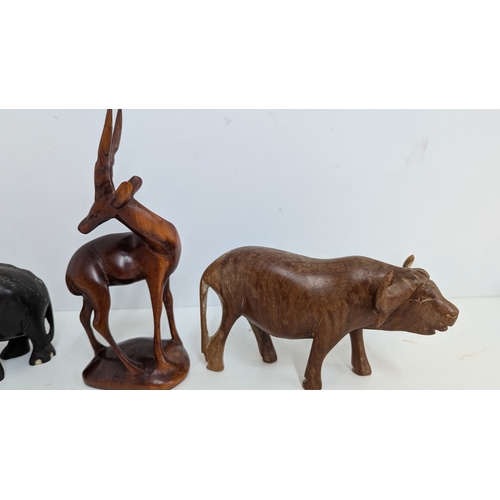 1127 - .Ebony Wooden Elephants ( one with leg missing) plus other wooden animals