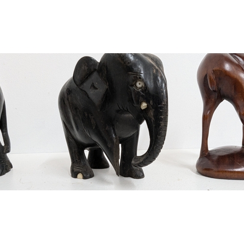 1127 - .Ebony Wooden Elephants ( one with leg missing) plus other wooden animals