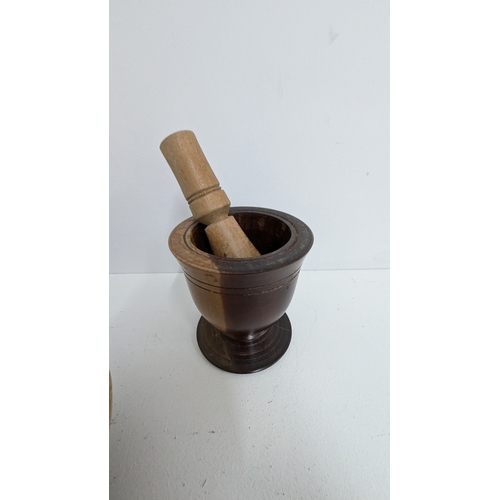 1128 - .Wooden Turned Pestles & Mortar x 2 plus a Lidded Pot