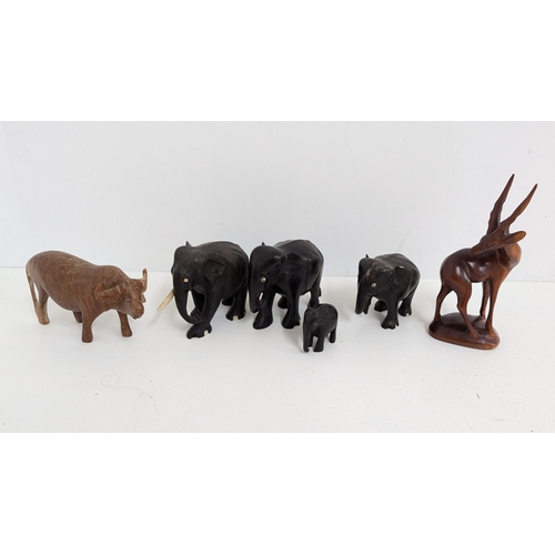 1165 - .Ebony Wooden Elephants ( one with leg missing) plus other wooden animals