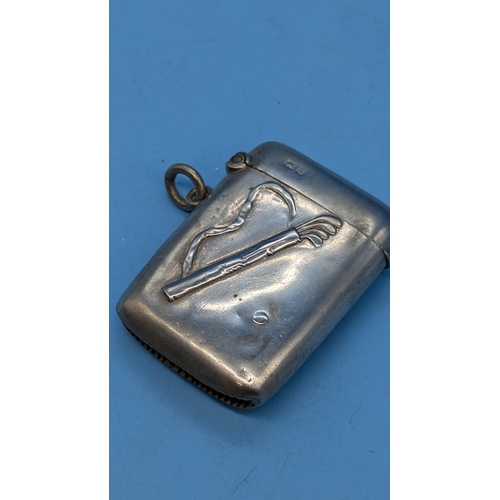 29 - A Golfing Themed Hallmarked Silver Vesta Case