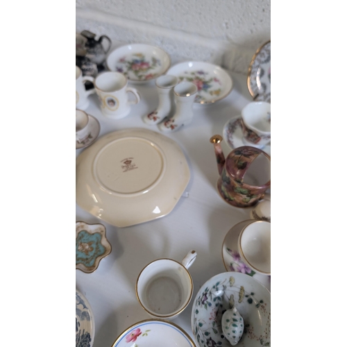 793 - A collection of Antique & vintage Miniature China & Porcelain Items including Spode, Royal Crown Der... 