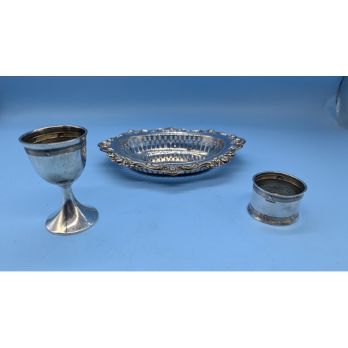 9 - An Egg Cup (800) Napkin Ring ( 800) and Repousse Dish. Hallmarked Silver ( 89 gms) George Nathan & R... 