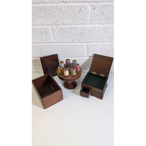 704 - Vintage Wooden Cotton Reel Holder with White Metal thimble and Reels, A Wooden Cigarette Box and ano... 