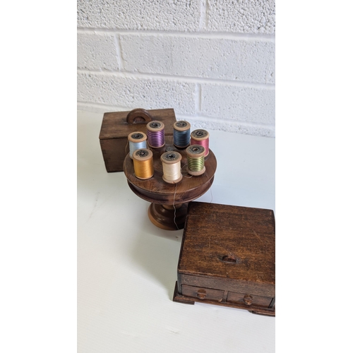 704 - Vintage Wooden Cotton Reel Holder with White Metal thimble and Reels, A Wooden Cigarette Box and ano... 