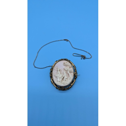 663 - A Large Pinchbeck And Carved Shell Brooch - 7 x 5.5cm