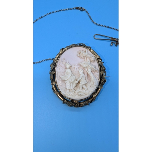 663 - A Large Pinchbeck And Carved Shell Brooch - 7 x 5.5cm