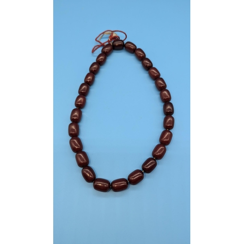 683 - A Cherry Amber Bakelite Necklace approx. 30.35grams