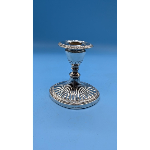 98 - A Hallmarked Silver Clay Filled Candlestick - 445gms Total