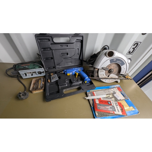 1118 - A 1400 Watt Circular Saw . Gas Powered Glue Gun and Jigsaw