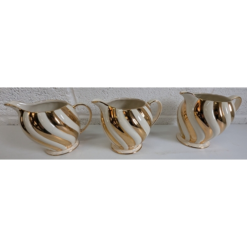 728B - A Trio Of Graduated Sadler Vintage Jugs