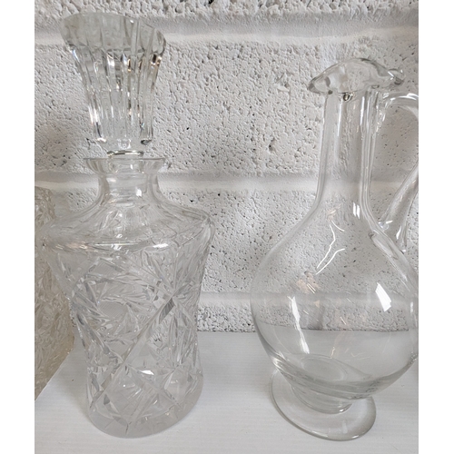 877 - An Assortment Of Cut Glass And Crystal Decanters And Carafes