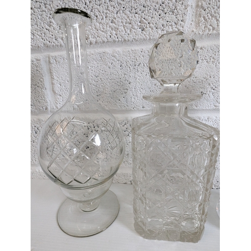 877 - An Assortment Of Cut Glass And Crystal Decanters And Carafes