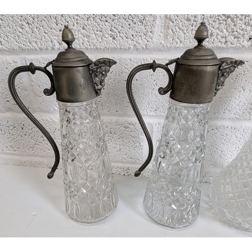 878 - 4 Cut Glass And Crystal Claret Jugs