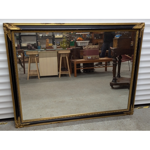 996 - Large Over Mantle Bevelled Mirror With Black And Gilt Frame - 107 x 136cm