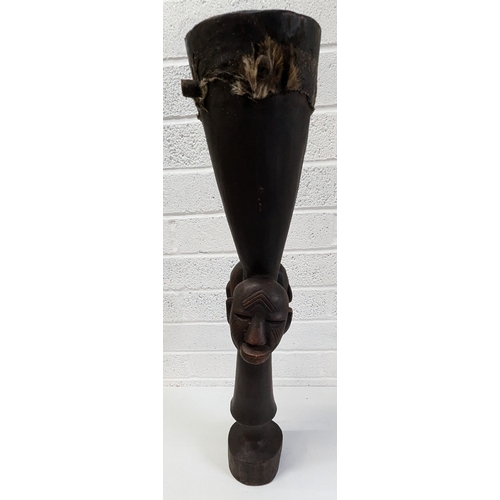 1024 - An African Tribal Drum With Carved Faces Standing 79cm High