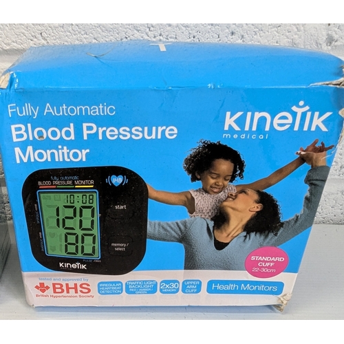 989 - A Pair Of Blood Pressure Monitors, A Kinetic Fully Automatic Blood Pressure Monitor, And A Wrist Ass... 