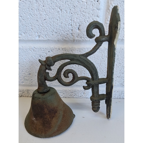 1390 - Vintage Cast Iron Wall Mounted Dinner Bell