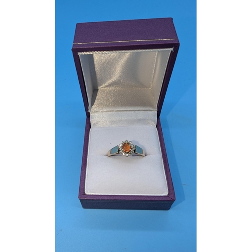 616 - A 9ct Gold Daisy Ring with Orange Sapphire Central Stone Size P