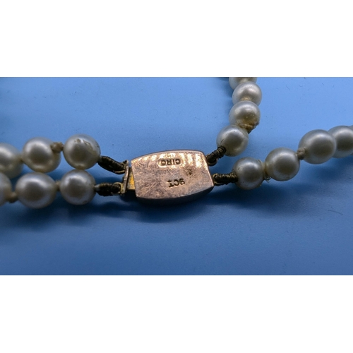 690B - A Ciro Cultured  Pearl Necklace With 9ct Gold Clasp