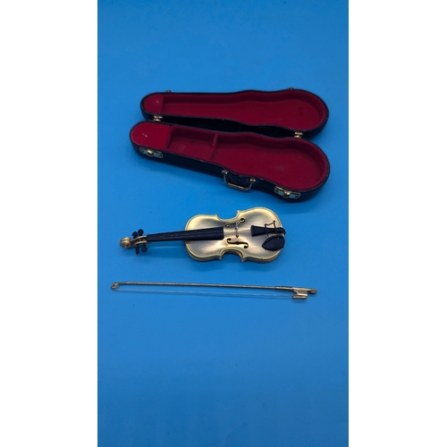 727 - A Miniature Golden Violin in Case approx. 10cm