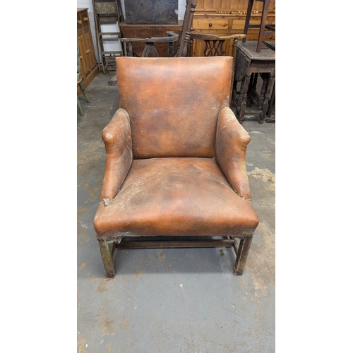 589 - A Leather Armchair for Restoration