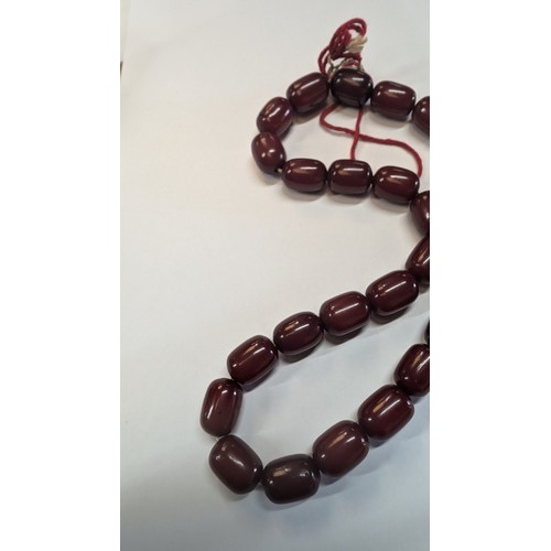 683 - A Cherry Amber Bakelite Necklace approx. 30.35grams