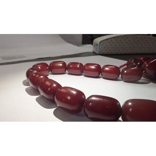 683 - A Cherry Amber Bakelite Necklace approx. 30.35grams