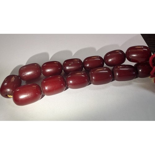 683 - A Cherry Amber Bakelite Necklace approx. 30.35grams