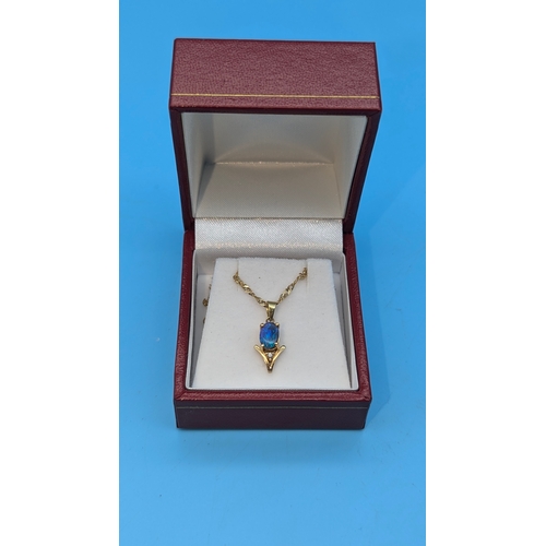 207 - An Opal and Diamond Pendant in 14ct Gold Setting on a 9ct Gold Chain