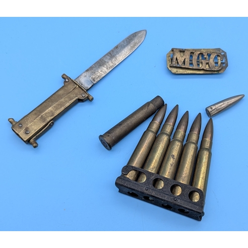 512 - A Trenchart Dagger, Machine Gun Corps Lapel Badge and inert Bullets