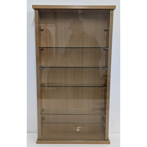 1021 - A Wall Hanging Display Cabinet With Tempered Glass Sliding Door And Shelves - 48 x 90cm