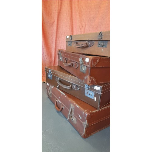 2411 - A Collection of 4 x Vintage Leather Suitcases