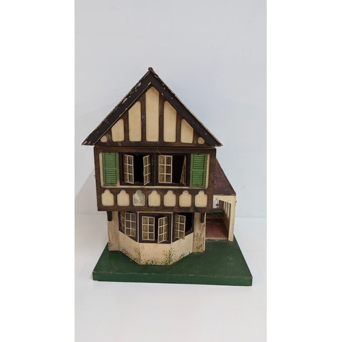 1866 - A Dolls House with Boxes of Furniture