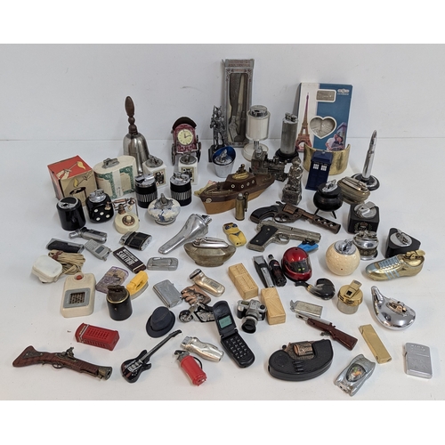 694 - A Large Quantity of Novelty Cigarette Lighters inc. Pistols, Eiffel Tower etc.