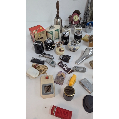 694 - A Large Quantity of Novelty Cigarette Lighters inc. Pistols, Eiffel Tower etc.