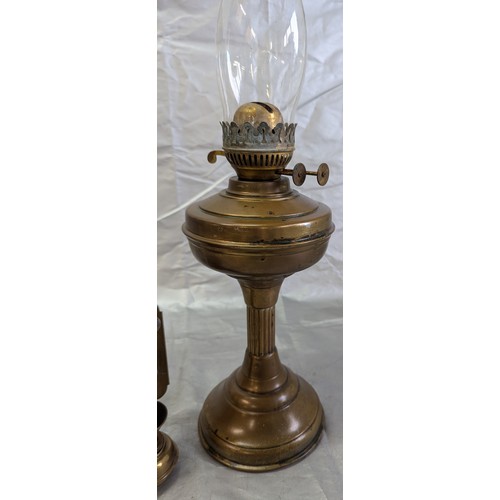 812 - A Brass Oil Lamp, Brass Wall Lamps, And Spare Chimney