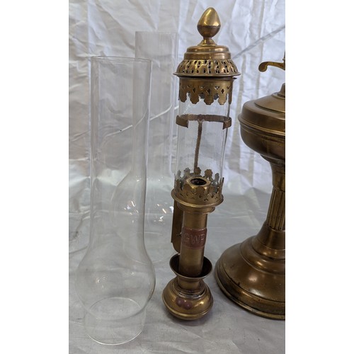 812 - A Brass Oil Lamp, Brass Wall Lamps, And Spare Chimney